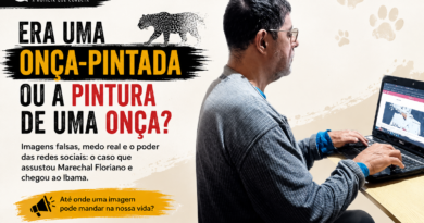 Homem diante do notebook em imagem sobre a falsa onça-pintada em Marechal Floriano, que teve registros analisados pelo Ibama por suspeita de manipulação digital e uso de inteligência artificial.